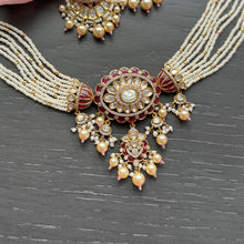 Load image into Gallery viewer, Ornate necklace and earrings set on a dark surface

