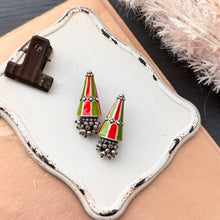 Load image into Gallery viewer, Sculptural oxidized earrings featuring a tapered cone silhouette, orange and lime-green detailing, and a cluster of tiny hanging metal beads.
